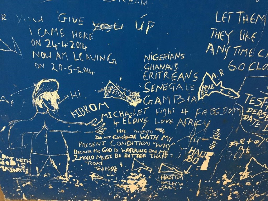 Writing on blue blackboard tells the story of inhabitants