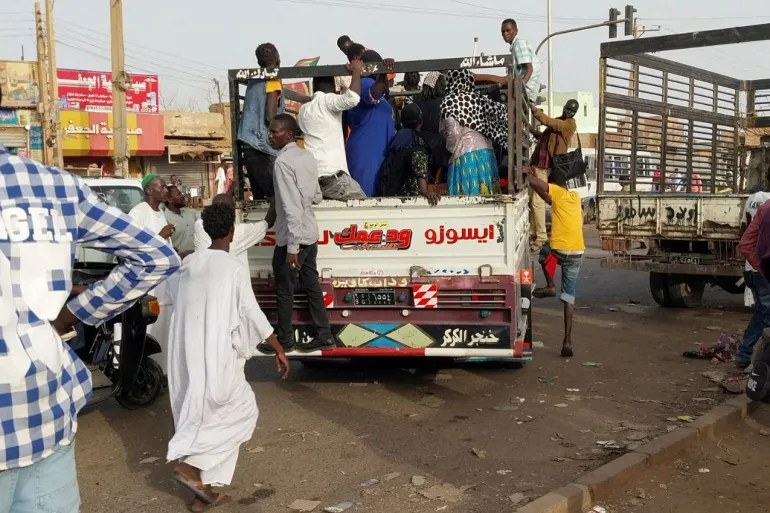 Photo: People board pickup trucks to flee fighting between the paramilitary Rapid Support Forces and the army in Bahri, also known as North Khartoum [Reuters]